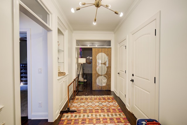 5215 Austin Rd, Hixson, TN 37343 - corridor featuring built in features, dark wood-style flooring, ornamental molding, and a chandelier