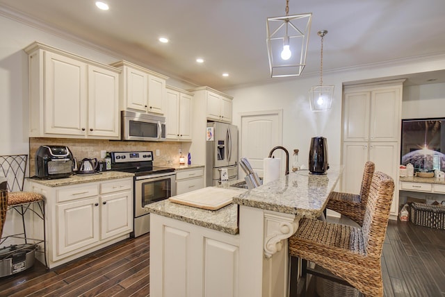 5215 Austin Rd, Hixson, TN 37343 - kitchen with appliances with stainless steel finishes, ornamental molding, dark wood-style floors, decorative backsplash, and a breakfast bar