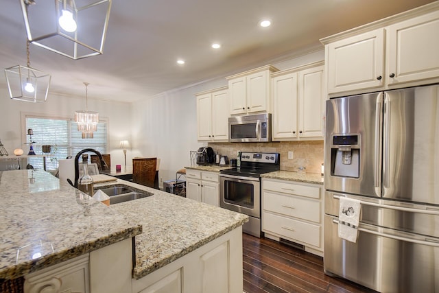 5215 Austin Rd, Hixson, TN 37343 - kitchen with stainless steel appliances, ornamental molding, backsplash, light stone counters, and dark wood-style floors