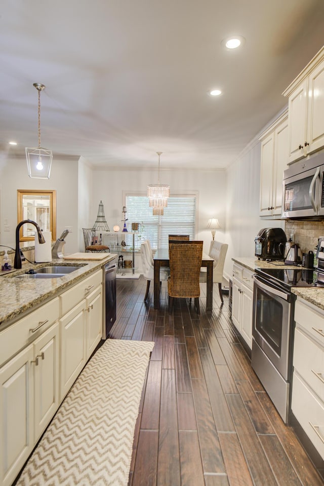 5215 Austin Rd, Hixson, TN 37343 - kitchen with appliances with stainless steel finishes, dark wood finished floors, recessed lighting, a chandelier, and pendant lighting