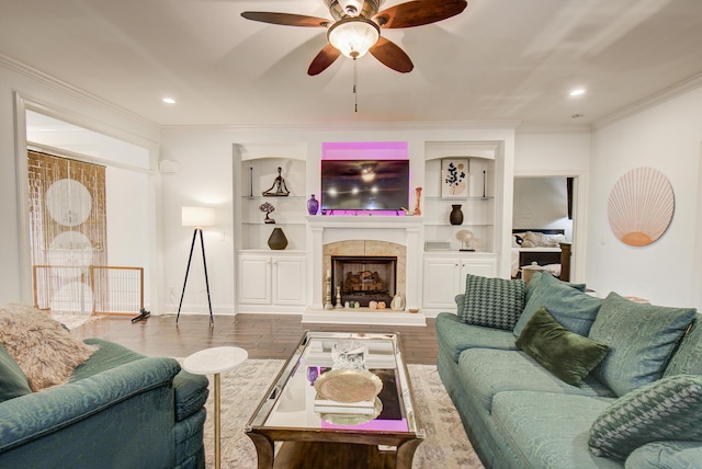 5215 Austin Rd, Hixson, TN 37343 - living area with a ceiling fan, ornamental molding, a tiled fireplace, built in features, and recessed lighting
