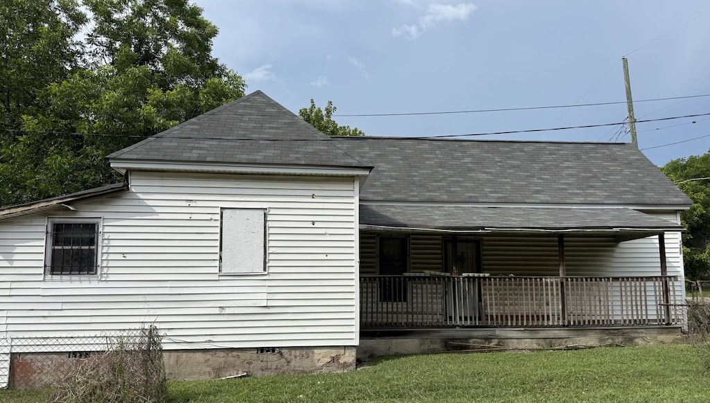 1701 Stanfiel St, Chattanooga, TN 37406 - view of front of property with crawl space, a shingled roof, a porch, and a front yard