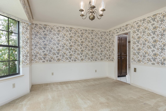 6515 Lake Shadows Cir, Hixson, TN 37343 - spare room featuring a chandelier, wainscoting, wallpapered walls, crown molding, and carpet