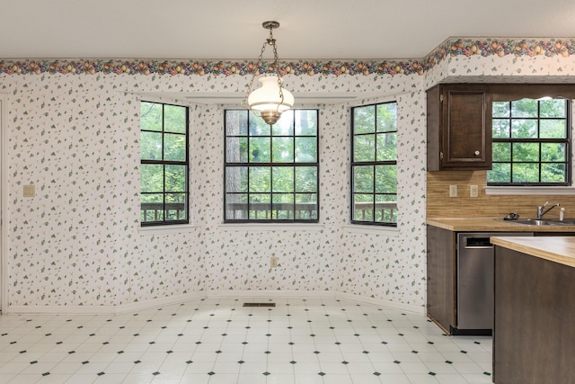 6515 Lake Shadows Cir, Hixson, TN 37343 - kitchen featuring dark brown cabinetry, wallpapered walls, pendant lighting, wood counters, and dishwasher