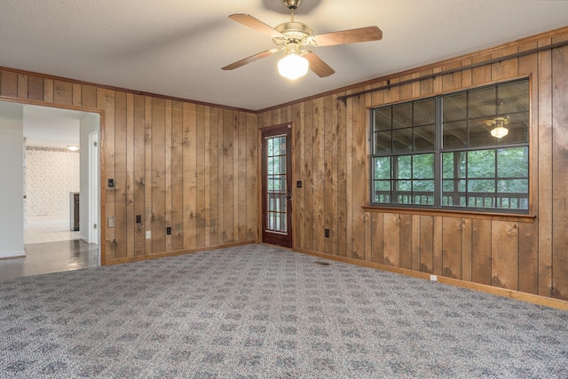 6515 Lake Shadows Cir, Hixson, TN 37343 - carpeted spare room featuring a ceiling fan, wood walls, and crown molding