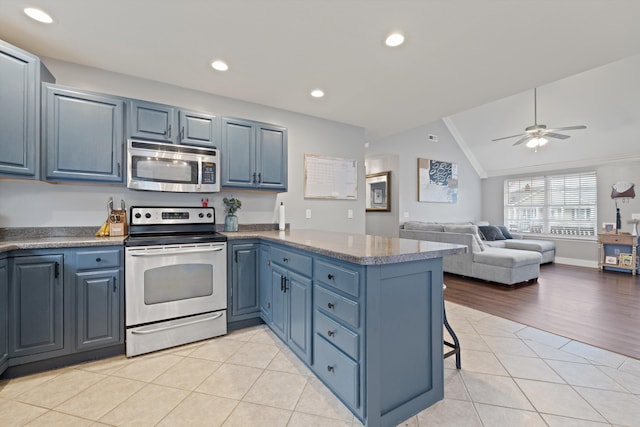 90 Quail Run, Lafayette, GA 30728 - kitchen with stainless steel appliances, a peninsula, vaulted ceiling, crown molding, and blue cabinets