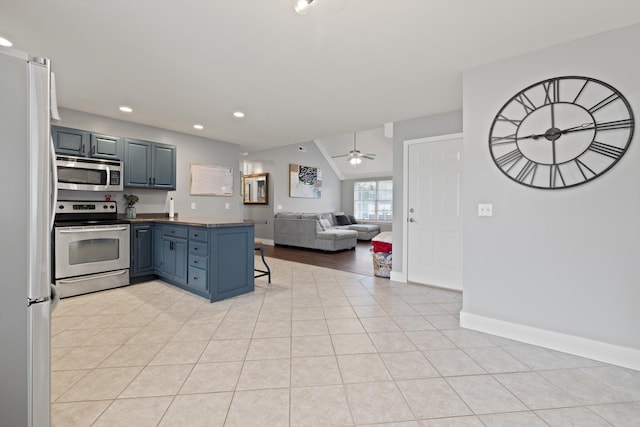 90 Quail Run, Lafayette, GA 30728 - kitchen with stainless steel appliances, open floor plan, a peninsula, recessed lighting, and dark countertops