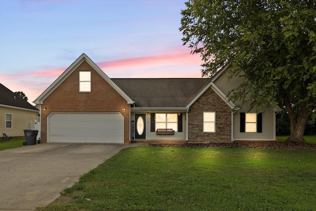 90 Quail Run, Lafayette, GA 30728 - view of front facade featuring concrete driveway, a garage, a yard, stone siding, and brick siding