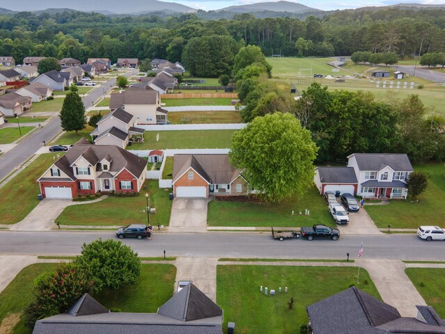 90 Quail Run, Lafayette, GA 30728 - aerial perspective of suburban area featuring a mountainous background and a heavily wooded area