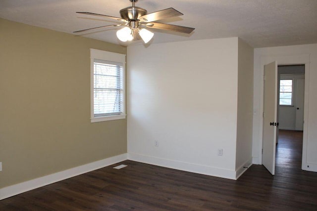 6248 Old Dunlap Rd, Whitwell, TN 37397 - empty room featuring plenty of natural light, dark wood-type flooring, and ceiling fan