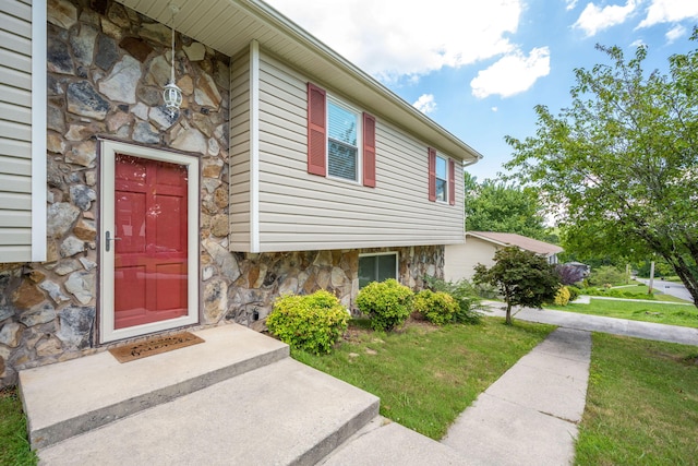 1107 Copperwood Dr, Hixson, TN 37343 - property entrance featuring stone siding and a yard