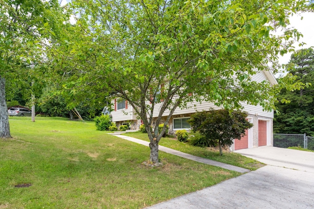 1107 Copperwood Dr, Hixson, TN 37343 - view of front of home with driveway, a garage, and stone siding