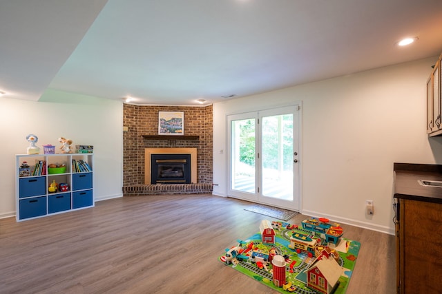 1107 Copperwood Dr, Hixson, TN 37343 - recreation room with wood finished floors and a fireplace