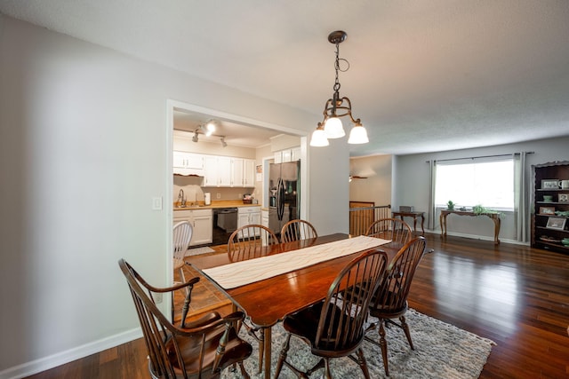 1107 Copperwood Dr, Hixson, TN 37343 - dining area featuring dark wood-type flooring and rail lighting