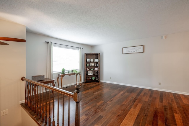 1107 Copperwood Dr, Hixson, TN 37343 - empty room featuring wood finished floors, a textured ceiling, and a ceiling fan