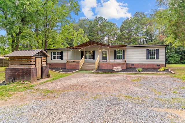 1483 Resaca Lafayette Rd NW, Resaca, GA 30735 - view of front of house with crawl space, a porch, a shed, and view of scattered trees