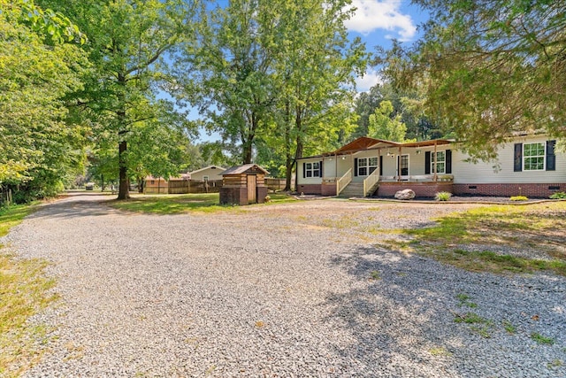 1483 Resaca Lafayette Rd NW, Resaca, GA 30735 - view of front facade featuring a porch, crawl space, and gravel driveway