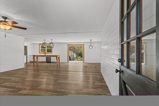1483 Resaca Lafayette Rd NW, Resaca, GA 30735 - interior space featuring a textured ceiling, wood finished floors, wooden walls, and ceiling fan