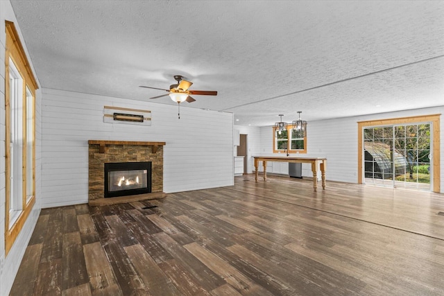 1483 Resaca Lafayette Rd NW, Resaca, GA 30735 - unfurnished living room featuring hardwood / wood-style flooring, ceiling fan, a textured ceiling, and a glass covered fireplace
