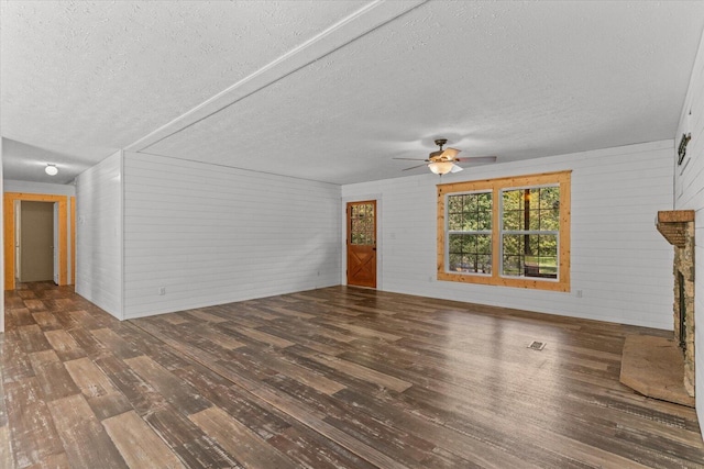 1483 Resaca Lafayette Rd NW, Resaca, GA 30735 - unfurnished living room with wood-type flooring, a textured ceiling, ceiling fan, and wood walls