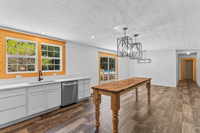 1483 Resaca Lafayette Rd NW, Resaca, GA 30735 - kitchen featuring stainless steel dishwasher, dark wood-style flooring, a textured ceiling, a chandelier, and light countertops