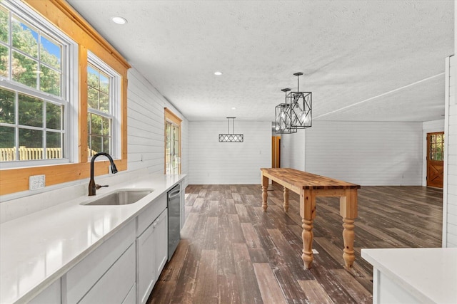 1483 Resaca Lafayette Rd NW, Resaca, GA 30735 - kitchen with a textured ceiling, dark wood-type flooring, dishwasher, a chandelier, and wood walls