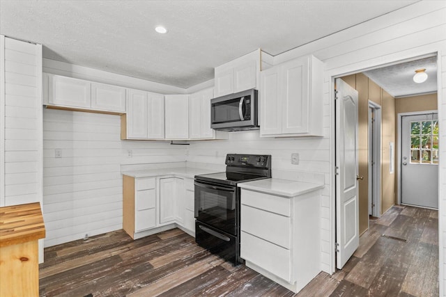 1483 Resaca Lafayette Rd NW, Resaca, GA 30735 - kitchen with black / electric stove, stainless steel microwave, dark wood-type flooring, light countertops, and white cabinets