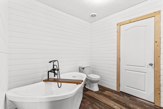 1483 Resaca Lafayette Rd NW, Resaca, GA 30735 - full bathroom featuring wood-type flooring, a soaking tub, a textured ceiling, and wood walls