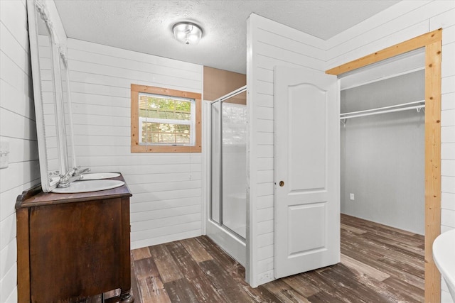 1483 Resaca Lafayette Rd NW, Resaca, GA 30735 - full bathroom featuring wood finished floors, a stall shower, wood walls, and vanity