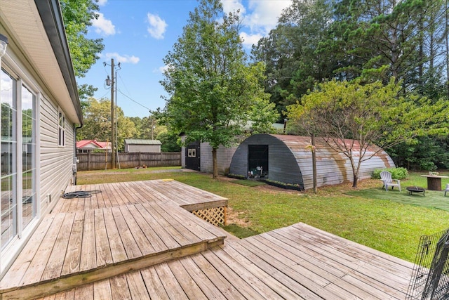 1483 Resaca Lafayette Rd NW, Resaca, GA 30735 - wooden terrace featuring an outdoor fire pit, a fenced backyard, and a storage unit