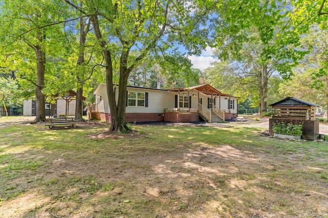 1483 Resaca Lafayette Rd NW, Resaca, GA 30735 - rear view of house featuring a porch, an outbuilding, and crawl space