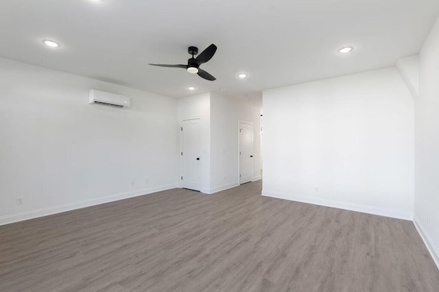 1306 Top St, Chattanooga, TN 37408 - unfurnished room featuring a wall unit AC, a ceiling fan, wood finished floors, and recessed lighting