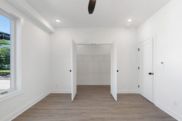 1306 Top St, Chattanooga, TN 37408 - unfurnished bedroom featuring light wood-style floors, a walk in closet, recessed lighting, and ceiling fan