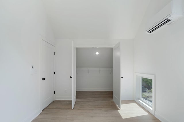 1306 Top St, Chattanooga, TN 37408 - laundry area with a wall mounted air conditioner and light wood-type flooring