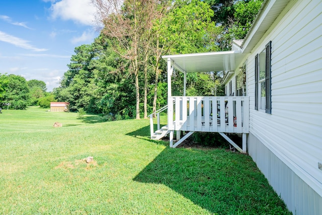 63 Applewood Ln, Chatsworth, GA 30705 - view of grassy yard featuring a deck and view of scattered trees