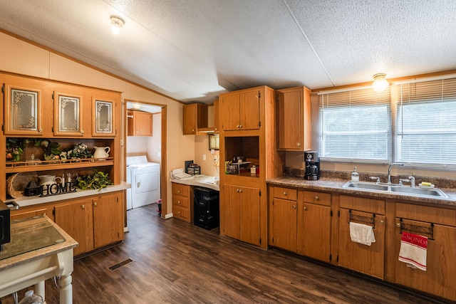 63 Applewood Ln, Chatsworth, GA 30705 - kitchen with vaulted ceiling, brown cabinetry, dark wood-type flooring, washer / clothes dryer, and a textured ceiling