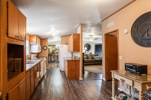 63 Applewood Ln, Chatsworth, GA 30705 - kitchen featuring dark wood-style floors, white appliances, brown cabinets, and ceiling fan