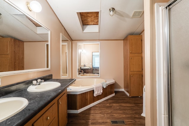 63 Applewood Ln, Chatsworth, GA 30705 - full bathroom with wood finished floors, double vanity, a garden tub, and a shower with door