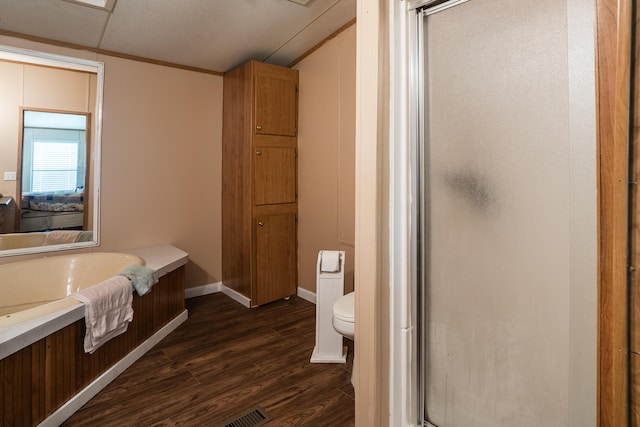 63 Applewood Ln, Chatsworth, GA 30705 - bathroom featuring a shower stall, wood finished floors, ensuite bath, a garden tub, and lofted ceiling