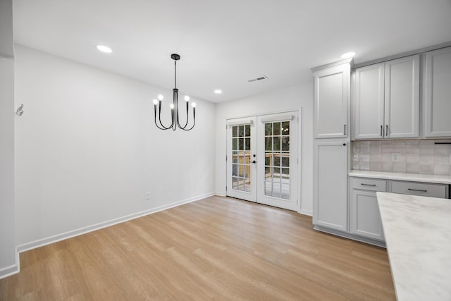 2427 Maplewood Dr, Chattanooga, TN 37421 - unfurnished dining area with french doors, light wood finished floors, a chandelier, and recessed lighting