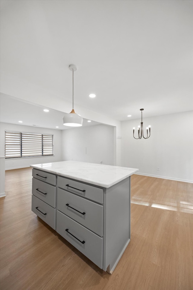 2427 Maplewood Dr, Chattanooga, TN 37421 - kitchen with gray cabinetry, light wood-type flooring, a kitchen island, recessed lighting, and open floor plan
