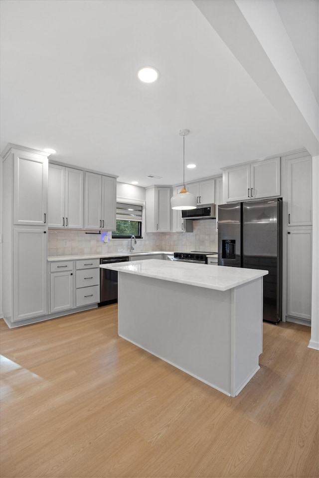 2427 Maplewood Dr, Chattanooga, TN 37421 - kitchen featuring dishwasher, fridge with ice dispenser, extractor fan, light wood-type flooring, and light countertops