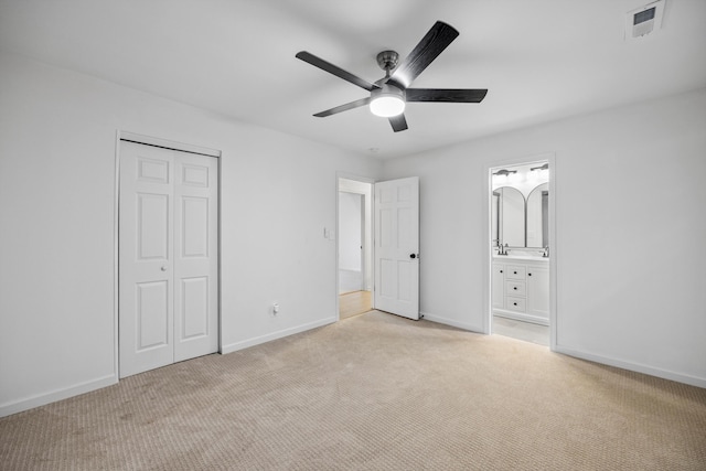 2427 Maplewood Dr, Chattanooga, TN 37421 - unfurnished bedroom with light carpet, a closet, connected bathroom, and a ceiling fan