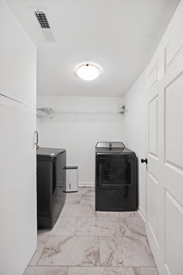 2427 Maplewood Dr, Chattanooga, TN 37421 - washroom with washer and dryer and light marble finish floors
