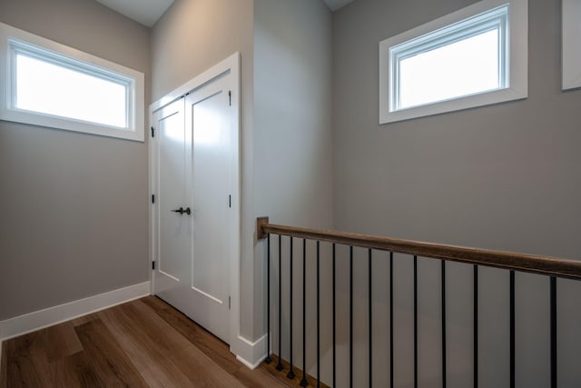 745 Burnside Pl, Chattanooga, TN 37408 - corridor with plenty of natural light, wood finished floors, and an upstairs landing