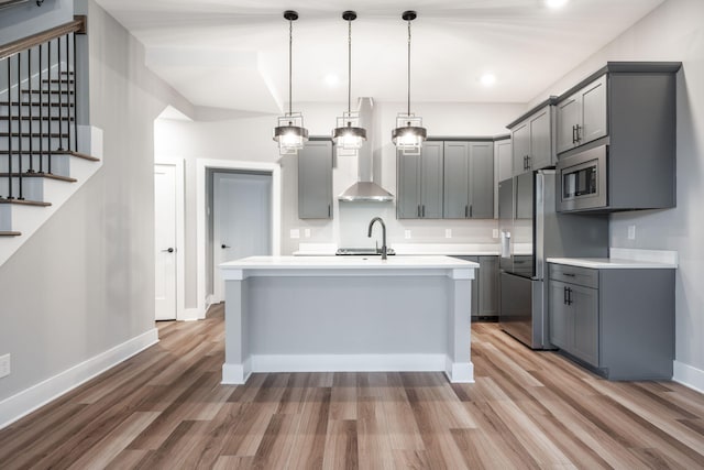 745 Burnside Pl, Chattanooga, TN 37408 - kitchen with gray cabinets, appliances with stainless steel finishes, light wood-type flooring, light countertops, and recessed lighting