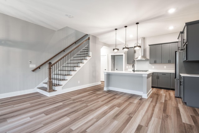 745 Burnside Pl, Chattanooga, TN 37408 - kitchen featuring gray cabinetry, wall chimney exhaust hood, light wood-type flooring, light countertops, and recessed lighting