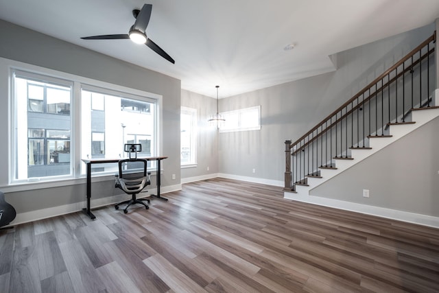 745 Burnside Pl, Chattanooga, TN 37408 - home office with wood finished floors, a ceiling fan, and a chandelier