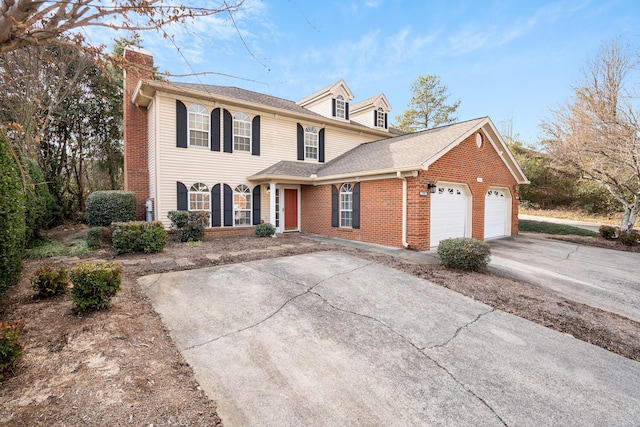 601 Black Oak Dr Unit 118, Dalton, GA 30721 - traditional-style home featuring a chimney, concrete driveway, brick siding, a garage, and roof with shingles