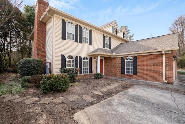 601 Black Oak Dr Unit 118, Dalton, GA 30721 - view of front facade with a chimney, brick siding, and a shingled roof